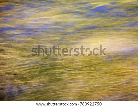 Abstract photo of reflections in Iron Creek. Could be used as a background or texture.