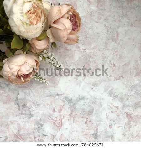 Peonies on a pink and white marble surface, background, texture