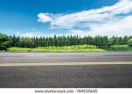 country asphalt road and green trees nature landscape in the summer Royalty-Free Stock Photo #784050640