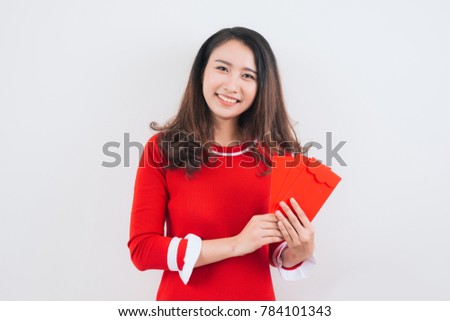 Vietnamese woman with lucky money envelopes for lunar new year