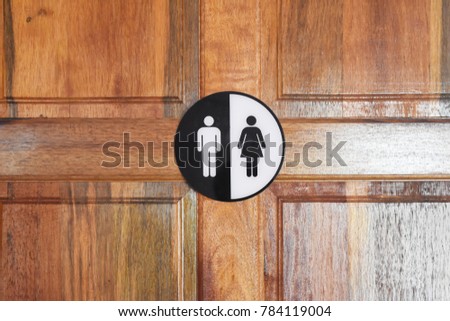 Man and Woman Bathroom Door Signs in toilet 