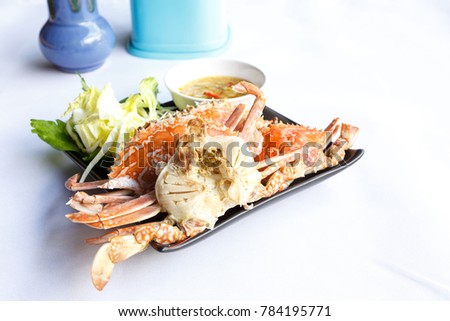 Fresh horse crabs on white table at restaurant  background