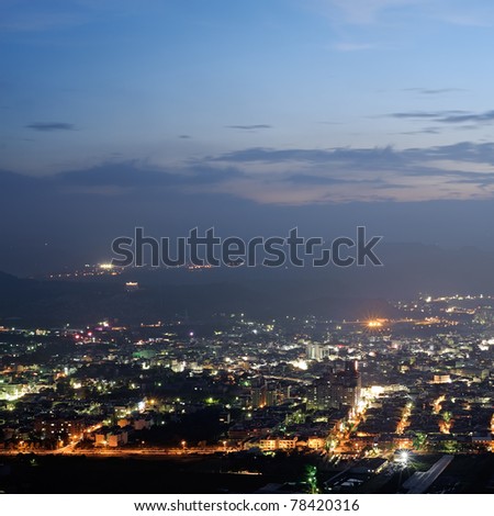 Cityscape of night scenery with houses and buildings under blue sky in Puli township, Nantou County, Taiwan, Asia.