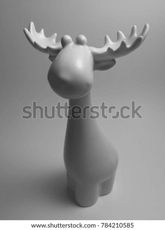 Ceramic elk or moose in a lightbox