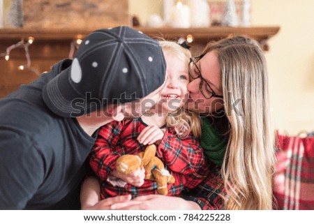 Cute young family on Christmas morning