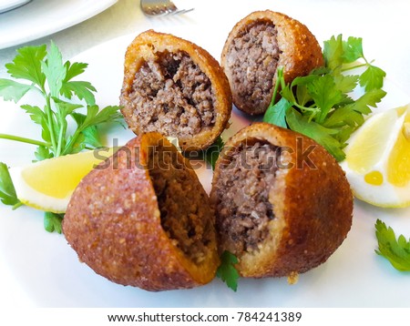 icli kofte / Boiled kibbeh / Quibe /  stuffed meatball falafel. Royalty-Free Stock Photo #784241389