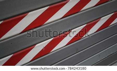 steel damper with white and red stripes in the elevation