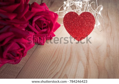 Red roses,Red heart on wooden table blackground.can use suitable for special occasion valentines day,mothers day,love,women day,happy anniversary 
event and space for text copy design.DOF image

