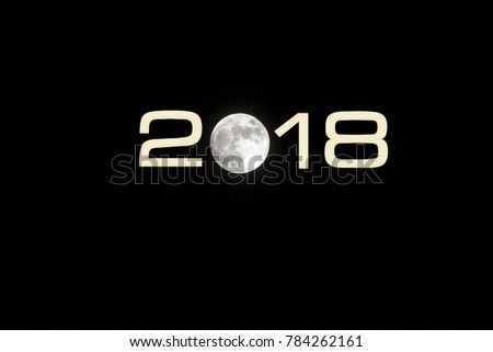 Happy new year 2018 with a background photo of full moon in the dark night, a shining bright moon portrayed as number zero for 2018