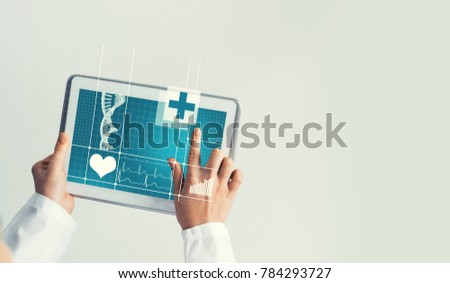 Tablet pc device with medicine interface screen in hands of doctor