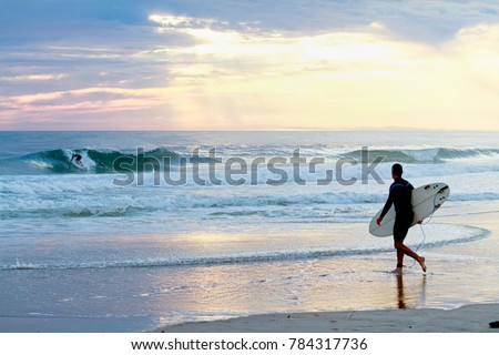 Surfer watching surfer. Royalty-Free Stock Photo #784317736