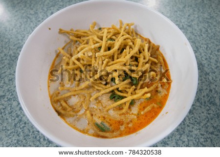 Khao soi (???????)  is Noodle soup with curry, this picture is Khao soi from Chaingrai Northern  of Thailand.
