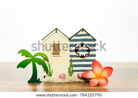 House with palm tree and orange plumeria 