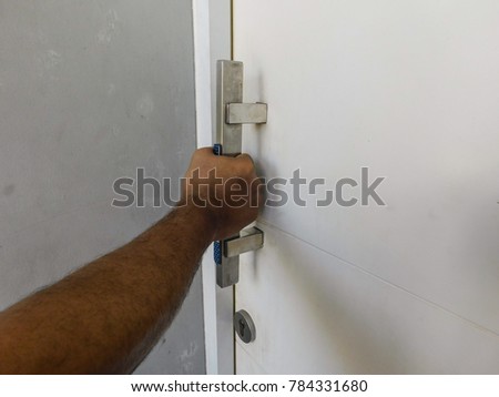 hand holding door handle