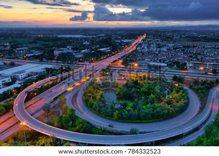 aerial view breautiful sunset Chiang mai city with ring road and traffic near chiang mai city Thailand 