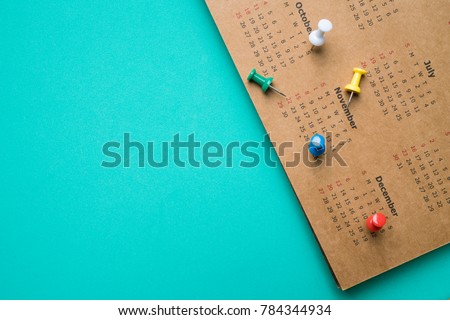 close up of calendar on green background, planning for business meeting or travel planning concept Royalty-Free Stock Photo #784344934