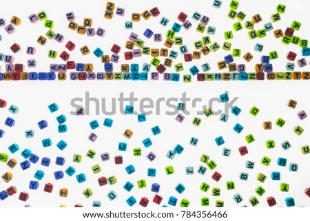 English alphabet Many colors are scattered. Is on a white background