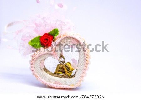 Two bell in white heart. 
Wedding gift. Valentine day.  Valentine background. Blurred background , blur picture.