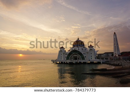 Malacca Straits Mosque (Masjid Selat Melaka) with beautiful dusk sky and natural low light background. It is a mosque located on the man-made Malacca Island near Malacca Town, Malaysia.