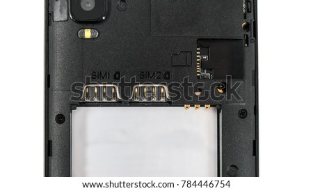 Slot for dual SIM cards and sd card, on a cell phone, mobile phone, smartphone close-up macro detail, isolated over white background