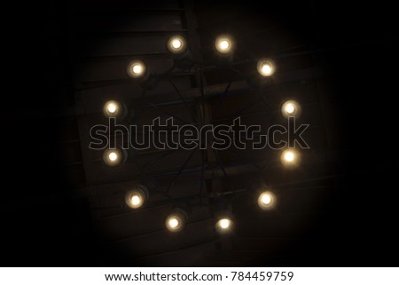 a picture of circular lights on a chandelier