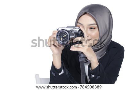 travel and holiday concept, young women holding digital camera over white background