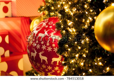 Christmas Tree Decorations with Gold and Christmas Red Design Balls Reindeer Silhouette. 