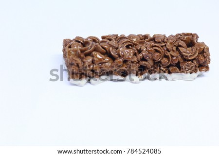 Cereal bar with cocoa isolated on white background. Chocolate Cereal Bar isolated on white background. Blurred background , blur picture.