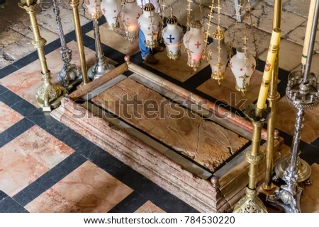 The Stone of Anointing, where Jesus' body is said to have been anointed before burial in the Church of the Holy Sepulchre in Jerusalem Royalty-Free Stock Photo #784530220