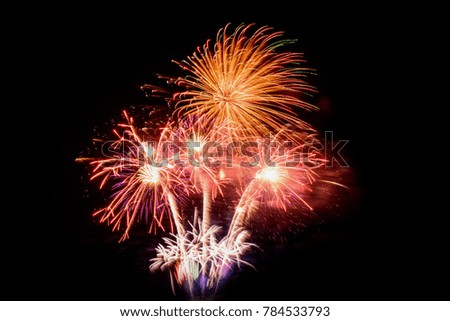 Fireworks Celebration at night on New Year and copy space. Abstract holiday background. Colorful fireworks celebration and the city night light background.