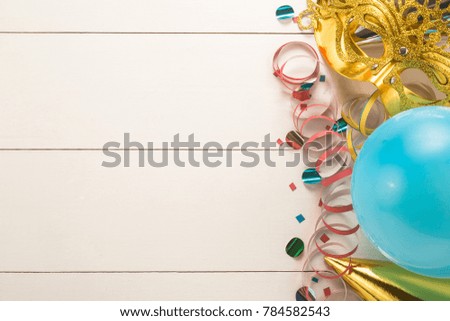 Colorful carnival on white wood background