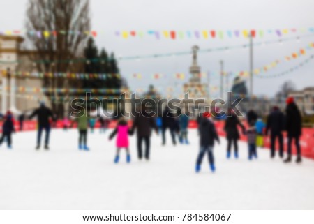 Blurred background with a lot of people ice skating on holiday defocused of indoor ice skating 