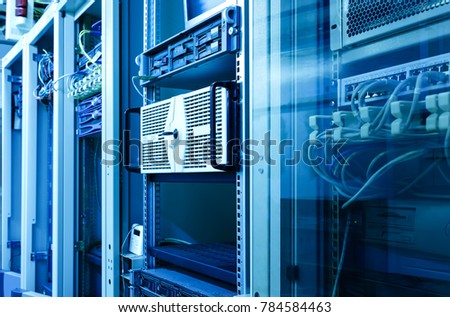 Many racks with servers located in the server room. Bright display a plurality of operating equipment