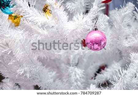 white Christmas balls on a white artificial Christmas tree, Christmas toys