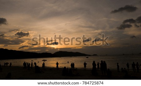 Silhouette of people at sunset period with sea. Sunset of Patong Beach ,Phuket is one of the most popular holiday destination in the world.