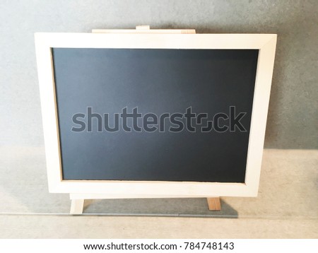 Backboard wooden frame. Write something in the blackboard space.