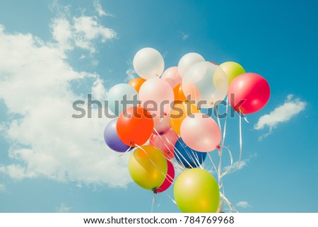 Colorful balloons done with a retro instagram filter effect. Concept of happy birth day in summer and wedding, honeymoon party use for background. Vintage color tone style