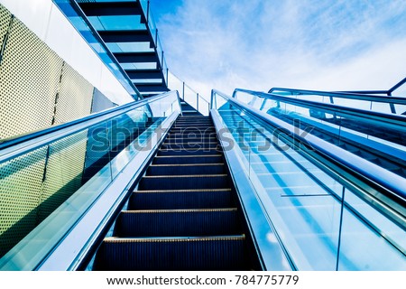 The elevator against the blue sky and cloud of a city outdoor