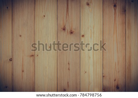 Brown wood texture with natural striped pattern for background, wooden surface for add text or design decoration art work. vintage tone with vignetting.