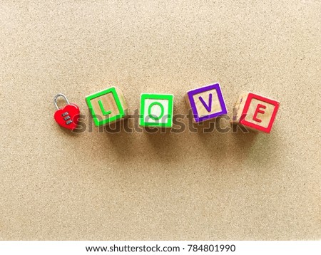 Wooden box Love word on the wooden board with lock red heart