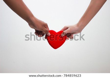 Valentine day, Men and women hold the same heart, About Valentine day and take care of your health. Time with loved ones. (selective focus,soft focus) Royalty-Free Stock Photo #784859623