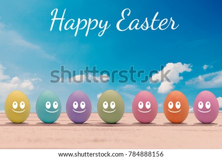 Colorful Easter eggs with face on a wooden board and the lettering happy Easter
