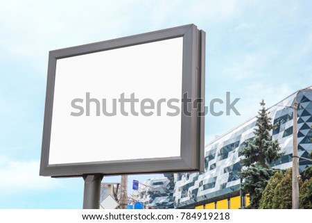 Empty advertising board on city street