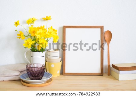 Mock up frame photo with kitchen utensil on table