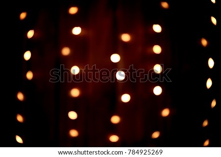 Abstract. Dark background. Yellow lights.