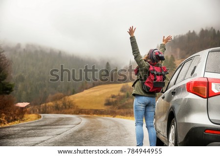 Happy tourist travelling in countryside