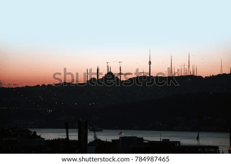 Building, roof and city silhouette. City details. Colorful sky. Istanbul. Turkey.
