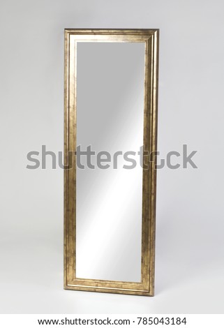 Large golden framed mirror isolated on white background
