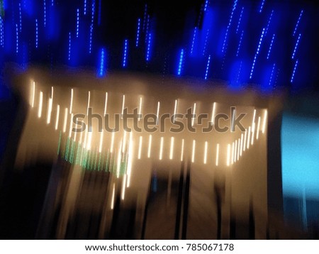 Multicolor Abstract City lights in motion. Good for Christmas and New Year celebrations. Abstract background of Blue, Green, Red, Yellow and white color. 