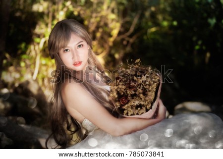 asian women beauti into the forrest.